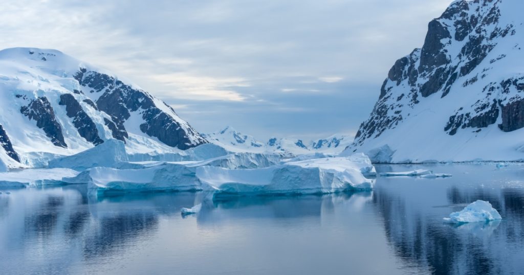 Crusing the Lemaire Channel among drifting icebergs, Antarctic Peninsula. Antarctica