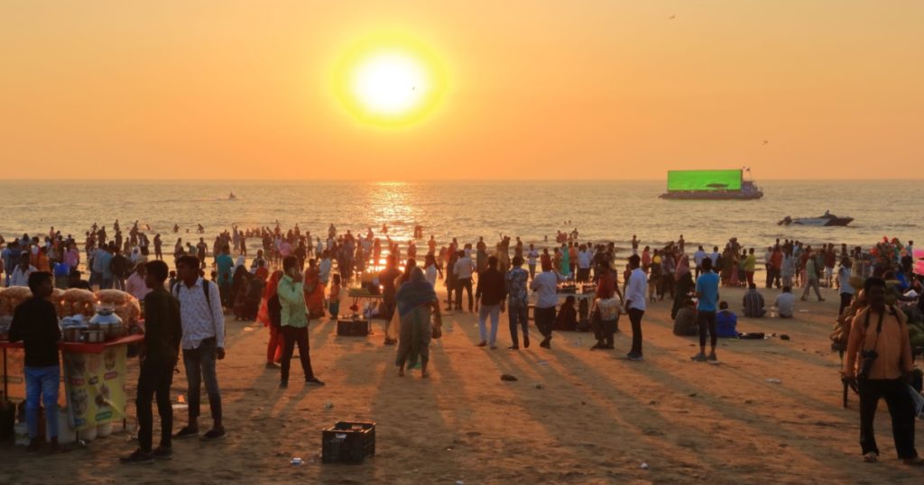 December 20 2022 - Mumbai, Maharashtra in India: people enjoy the sunset on Juhu Beach