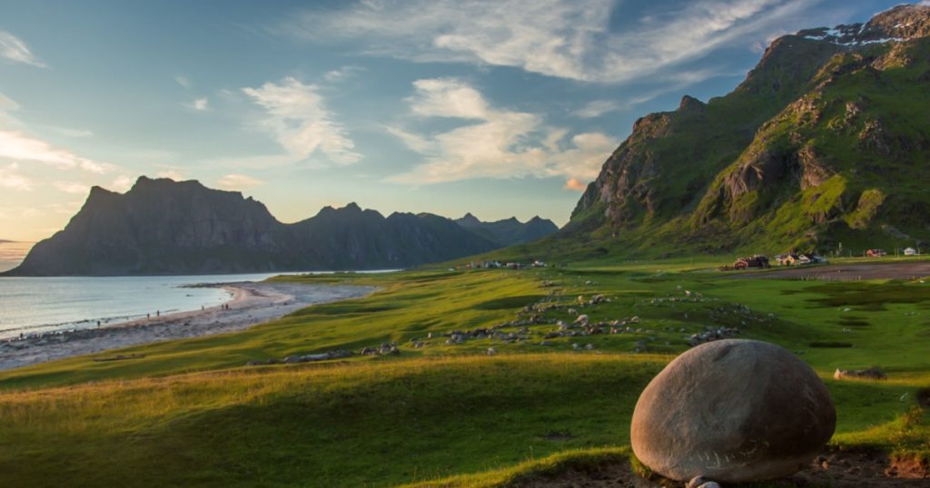 Black boulders, crystal water; Utakleiv, Pebble beach; Red rock; Stone circle; Striated rock; Moskenesøya, Lofoten Islands, Arctic Norway; Utakleiv beach, Vestvågøya, Lofoten Islands, Arctic Norway