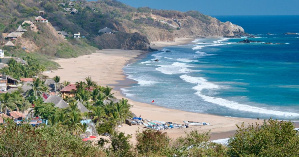Mexico Playa Zipolite Beach View of Golden Sand Bay and surf