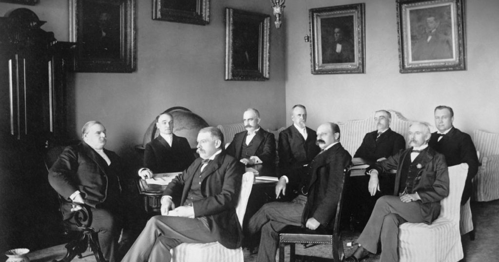President Grover Cleveland and his cabinet, 1895-96. L-R: The President; John Carlisle, Treasury; Richard Olney, State; Judson Harmon, Attorney General; Hilary Herbert, Navy; Daniel S. Lamont, War; Ju