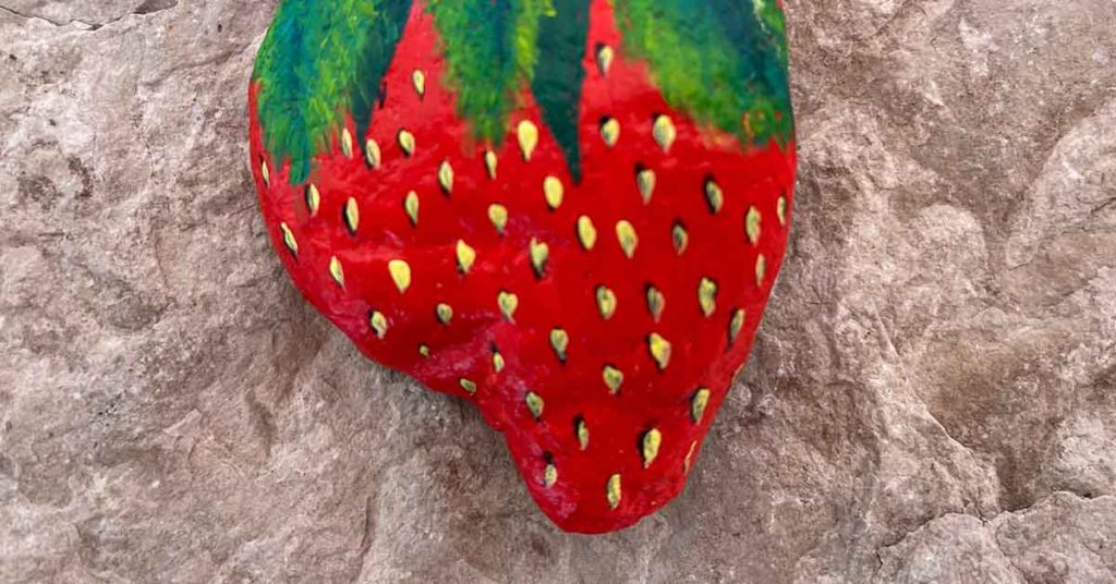 Keep Critters Away From Your Garden By Painting Rocks To Look Like Strawberries - Featured image