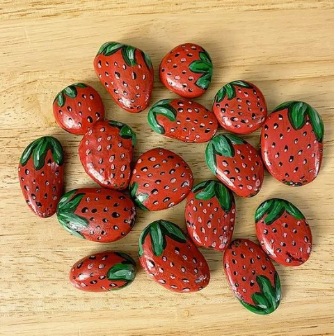 Rocks painted as strawberries