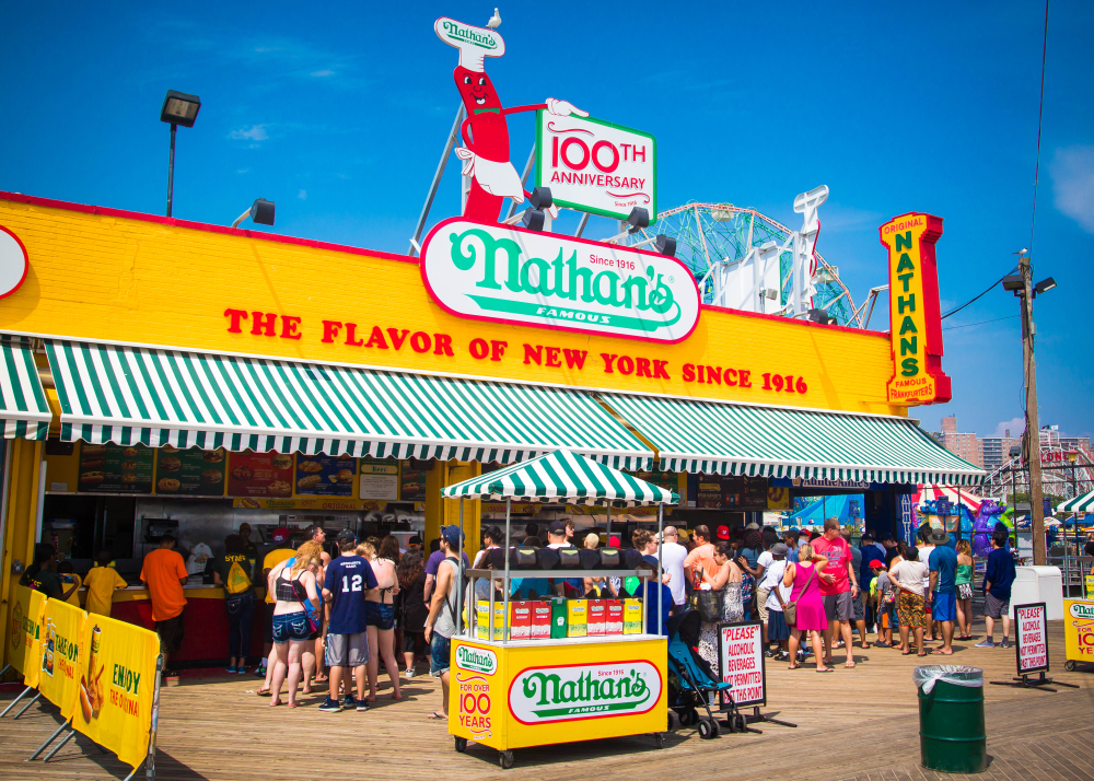 New York City, NY/USA - July 28, 2016: People gather at the famous hot dog restaurant, Nathan's, at Coney Island, NYC
