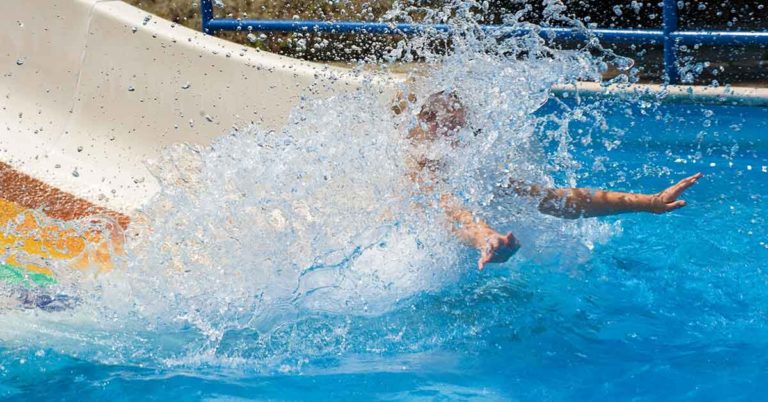 World Champion Diver Dfiantly Ignores ‘No Women’ Sign on Waterslide, Goes Down Anyways - Featured image