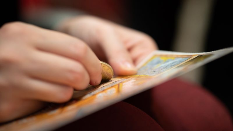 A woman claimed $100,000 in the lottery — then on her way home she won $300,000 more - Featured image