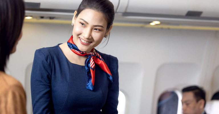 Flight Attendant Explains Why Your Answer is Very Important When They Greet You When Boarding a Plane - Featured image