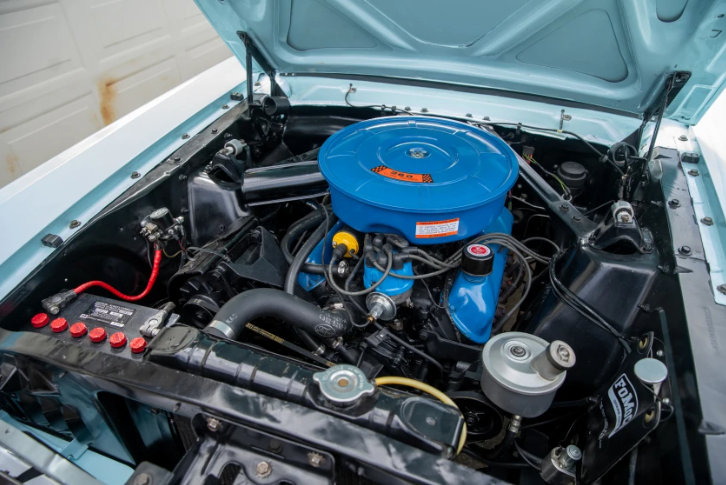 The pristine restored engine of the first Ford Mustang ever sold in the United States.
