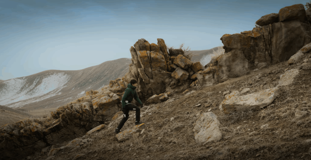 man walking on mountain