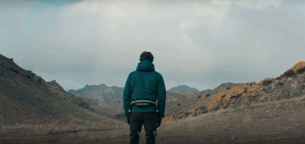 man standing in wilderness