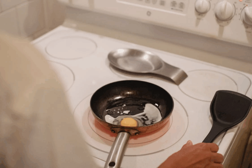 Crop person cooking fried eggs
