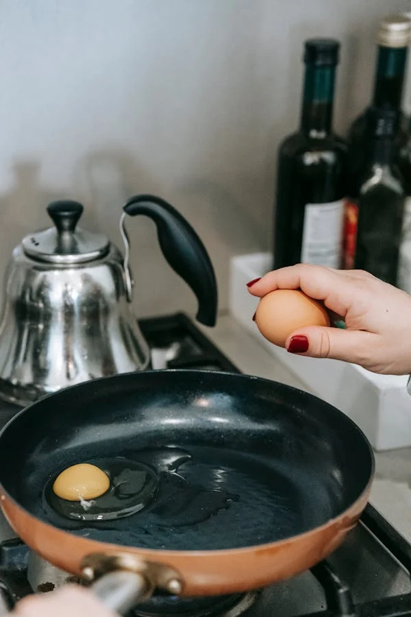 woman cracking egg