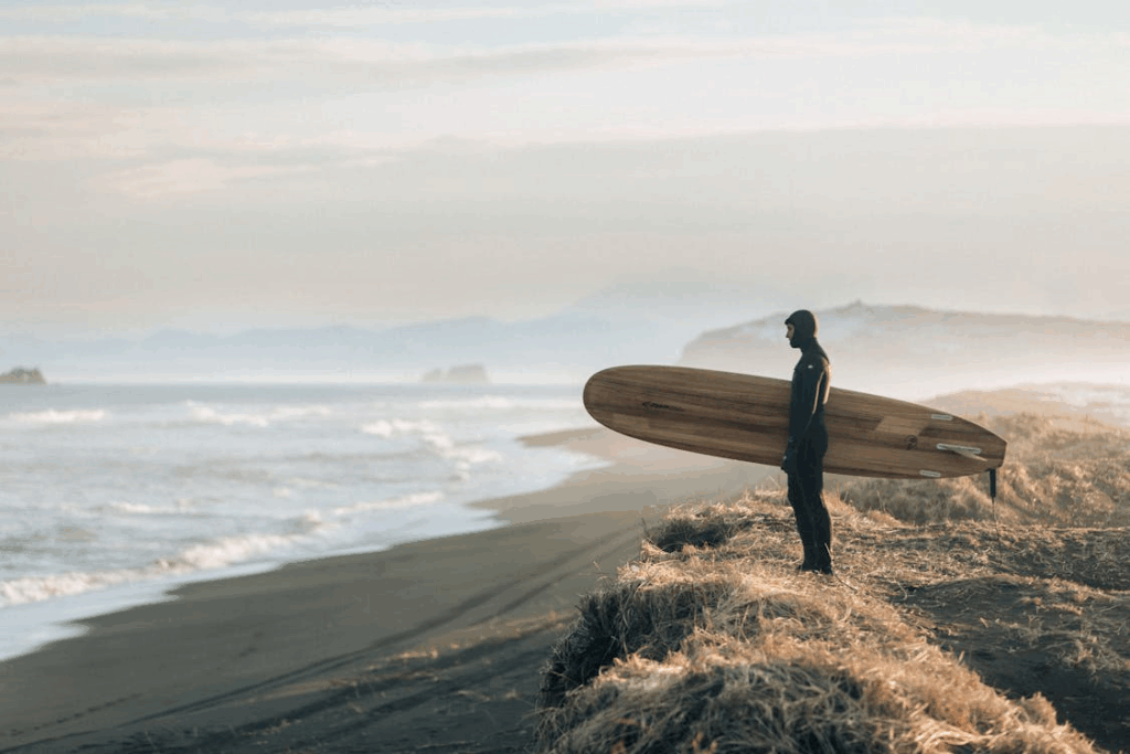 surfer looking at beach