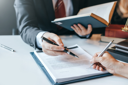 Businessman and lawyer discuss the contract document. Treaty of the law. Sign a contract business.