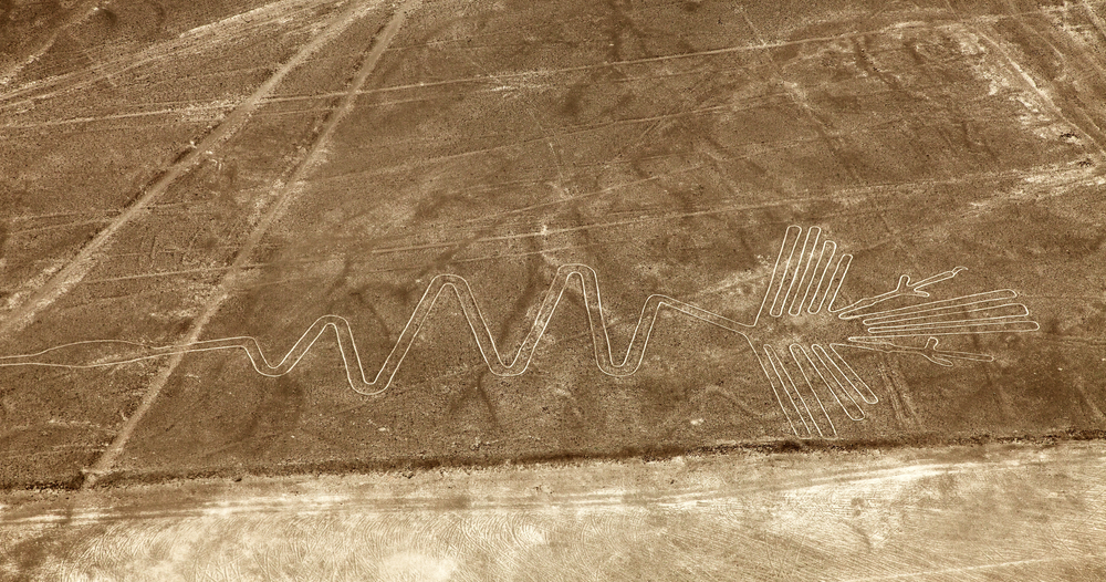 flamingo geoglyph, Nazca mysterious lines and geoglyphs aerial view sepia colored, landmark in Peru