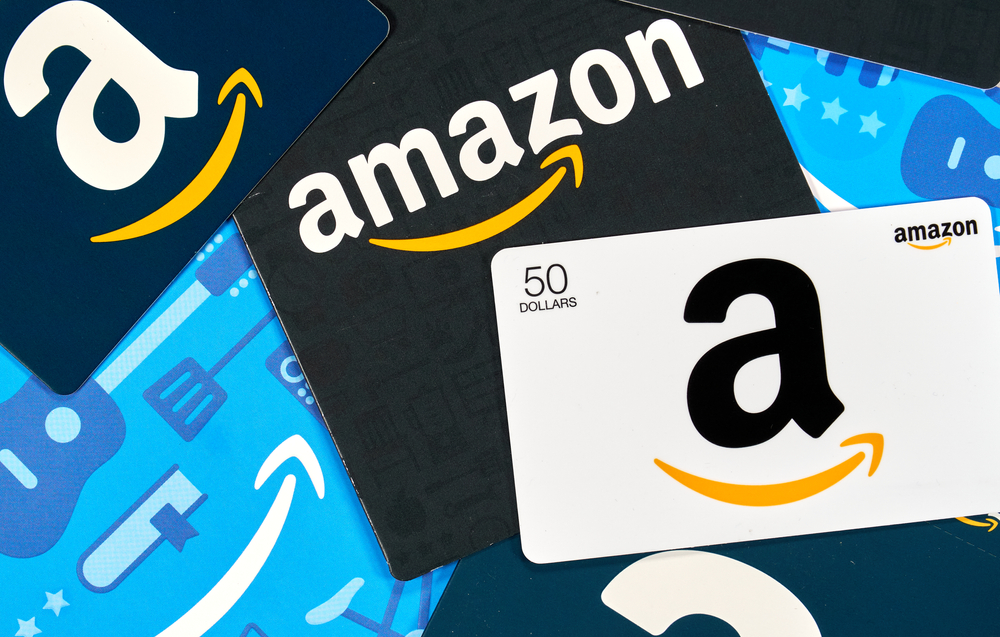 Montreal, Canada - April 6, 2020: Different Amazon gift cards. Amazon is a titan of e-commerce, payments, hardware, data storage, cloud computing, and media. It is founded and run by Jeff Bezos