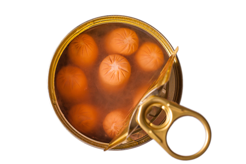 Delicious frankfurters in an opened can on white isolated background.
