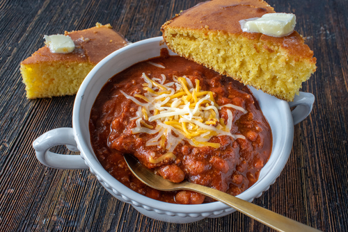 closeup of bowl of homemade chili with cornbread