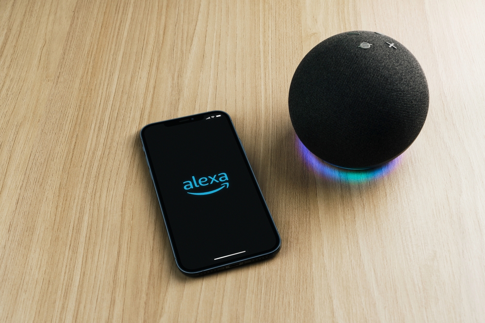 Alexa, Smart speaker and virtual assistant from Amazon company connected to smartphone app. Wooden background. Rio de Janeiro, RJ, Brazil. September 2021.