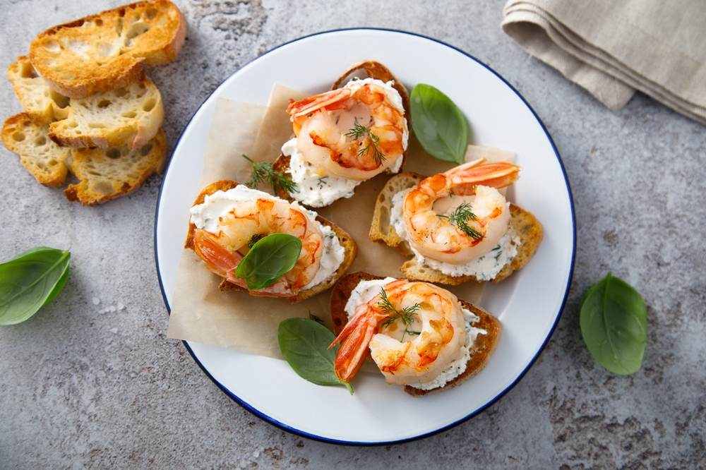Roasted shrimps with cream cheese on toast