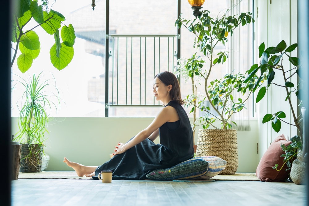 https://www.shutterstock.com/image-photo/woman-relaxing-surrounded-by-foliage-plants-2157193473
