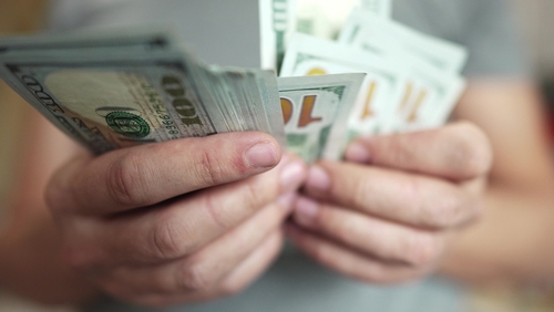 man counting money