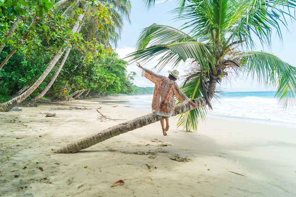 The feeling of freedom on the beach in a tropical paradise. Costa Rica, Caribbean coast.