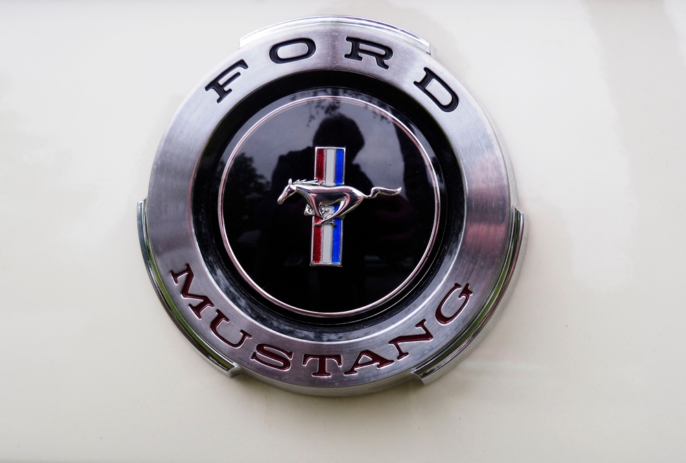 Germany, Eging-am-See - May 8, 2024: Us Car show. 1965 Ford Mustang emblem. The first production Mustang rolled off the assembly line on March 9, 1964, as a 1965 model.