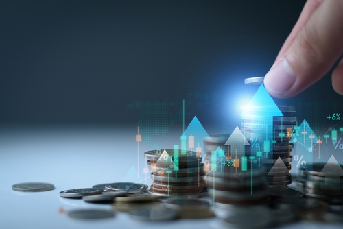 Save money for investment concept. Stack of coins with trading chart in financial, stock market, wealth economy, interest rate, Inflation and tax. Saving money, long term investment