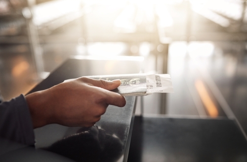 Passport, hands or identification book at airport for checking, booking or flight compliance, registration or process. Travel, documents or person at terminal with visa, information or journey ticket