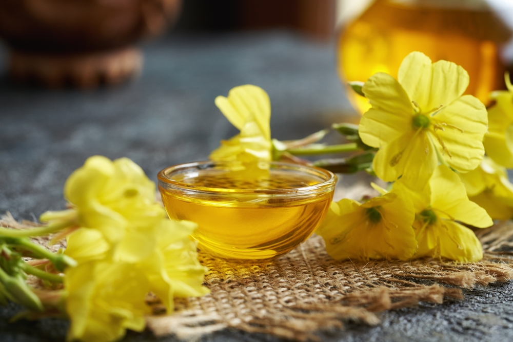Evening primrose oil in a transparent glass bowl - healthy nutritional supplement