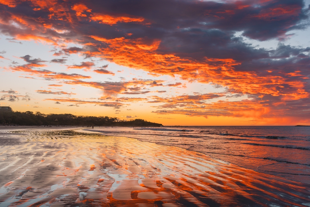 Playa Tamarindo beach at sunset