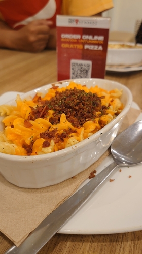 Grobogan Central Java, Indonesia. September 26, 2024. Cheese beef fusilli pizza hut is one of the mainstay menus.