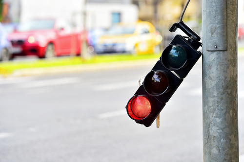 Broken traffic lights pole changing colors