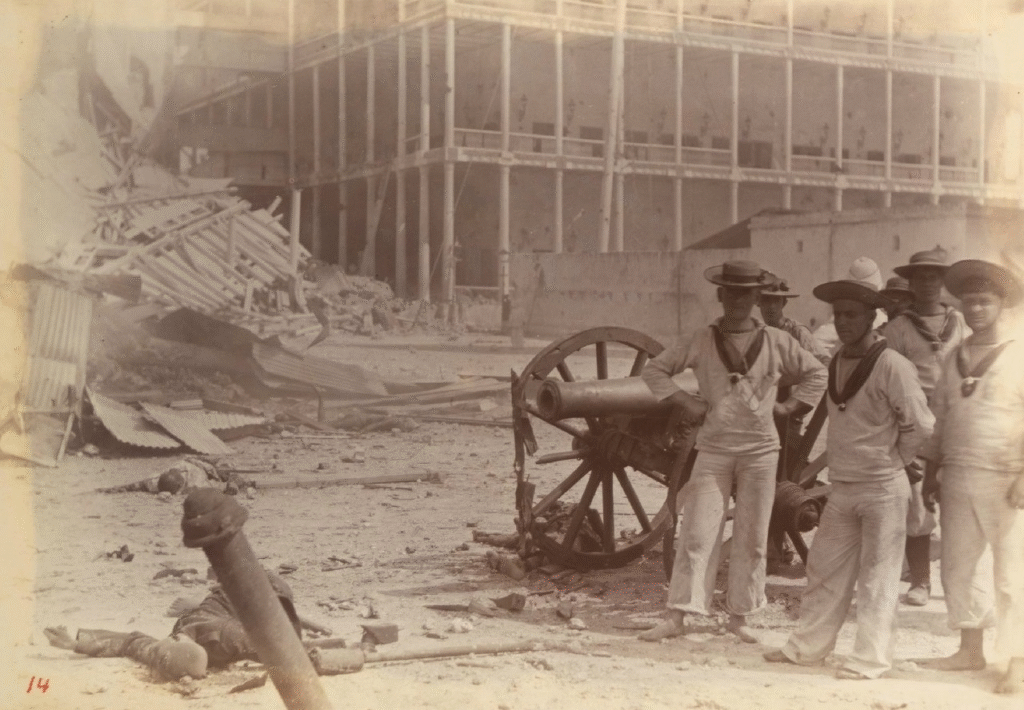 British marines pose with a captured Zanzibari gun following the capture of the Sultan's palace in Zanzibar Town