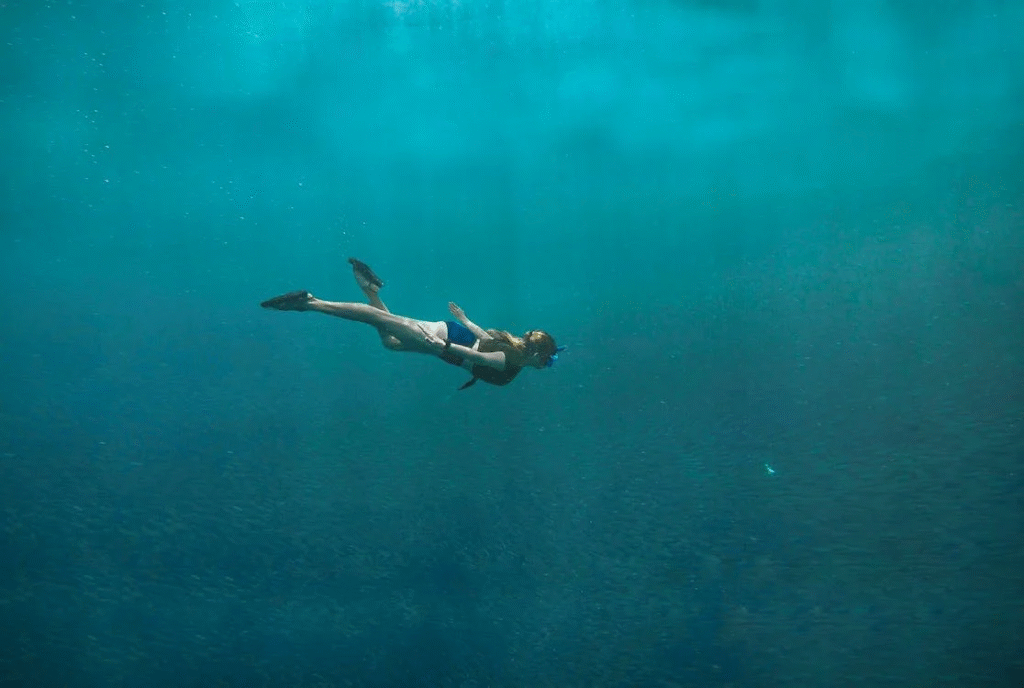 woman diving in ocean
