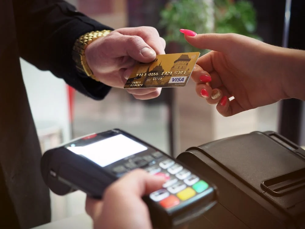 woman giving credit card