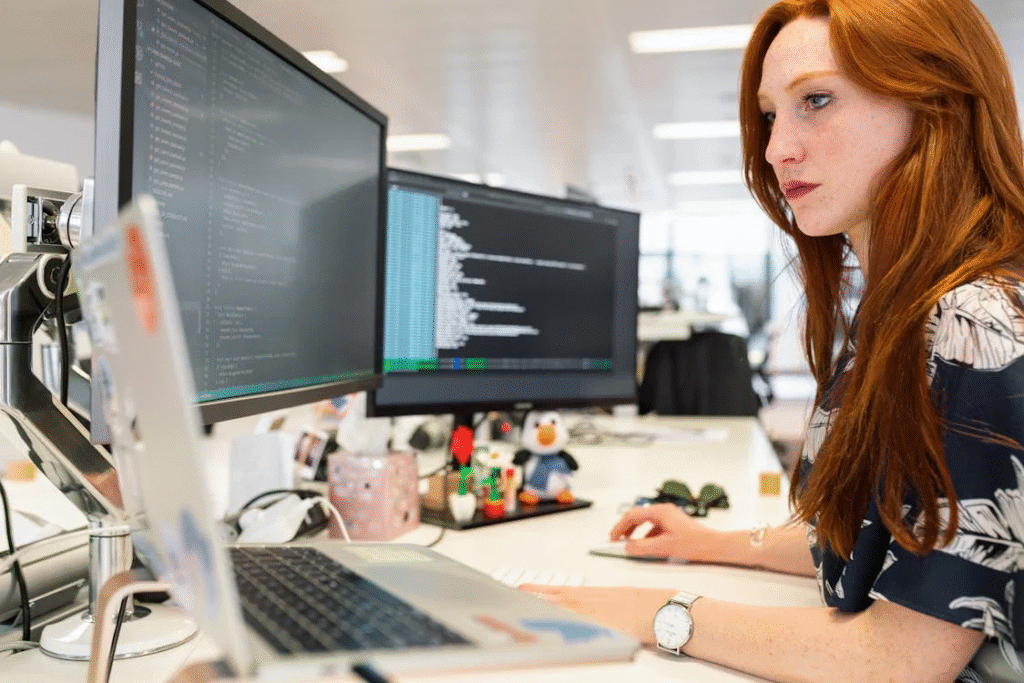woman at desk working on code