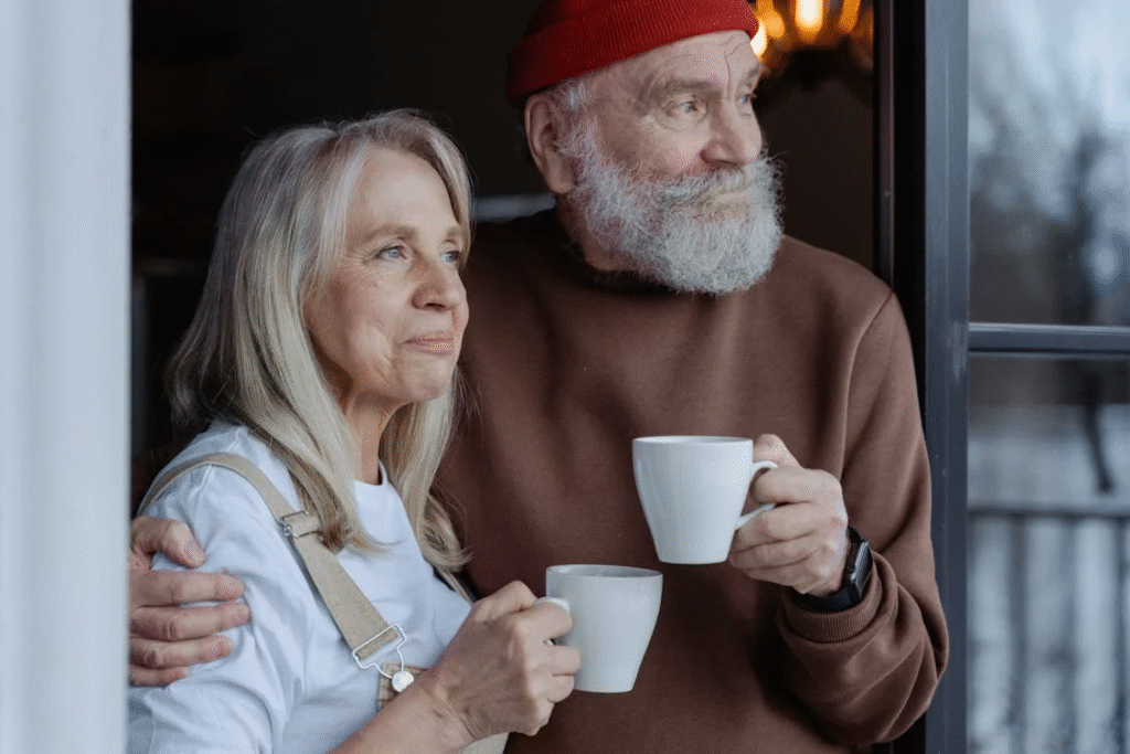retired couple holding cups