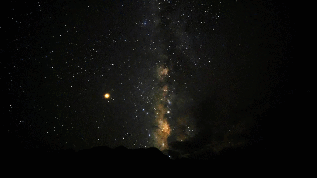 Silhouette of Mountain Under Starry Night
