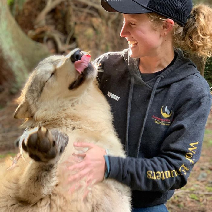 woman being friendly woth wolf