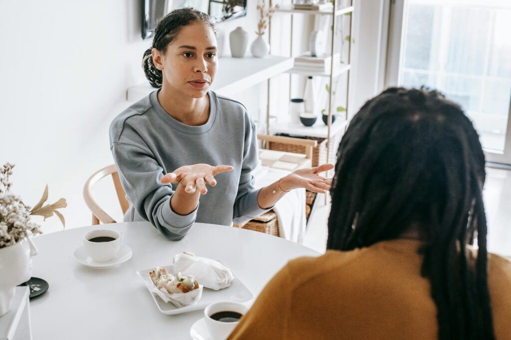 woman having breakfast talking