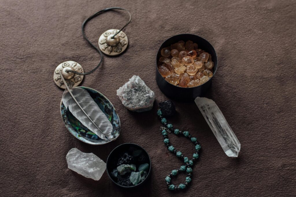 A Close-Up Shot of Healing Crystals and a Tingsha