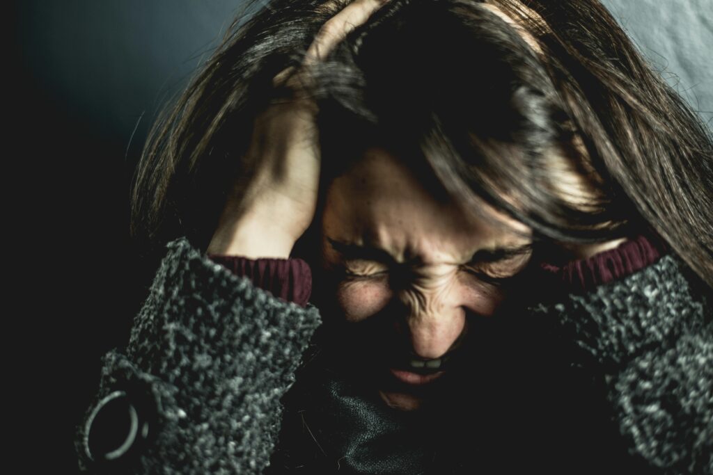 angry woman holding head
