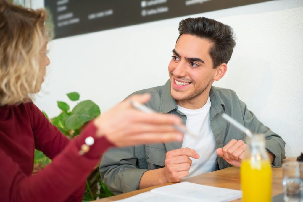 eager man talking to woman