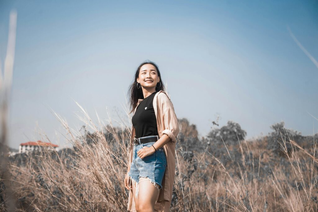 Photo of a Woman in Denim Shorts Looking Up