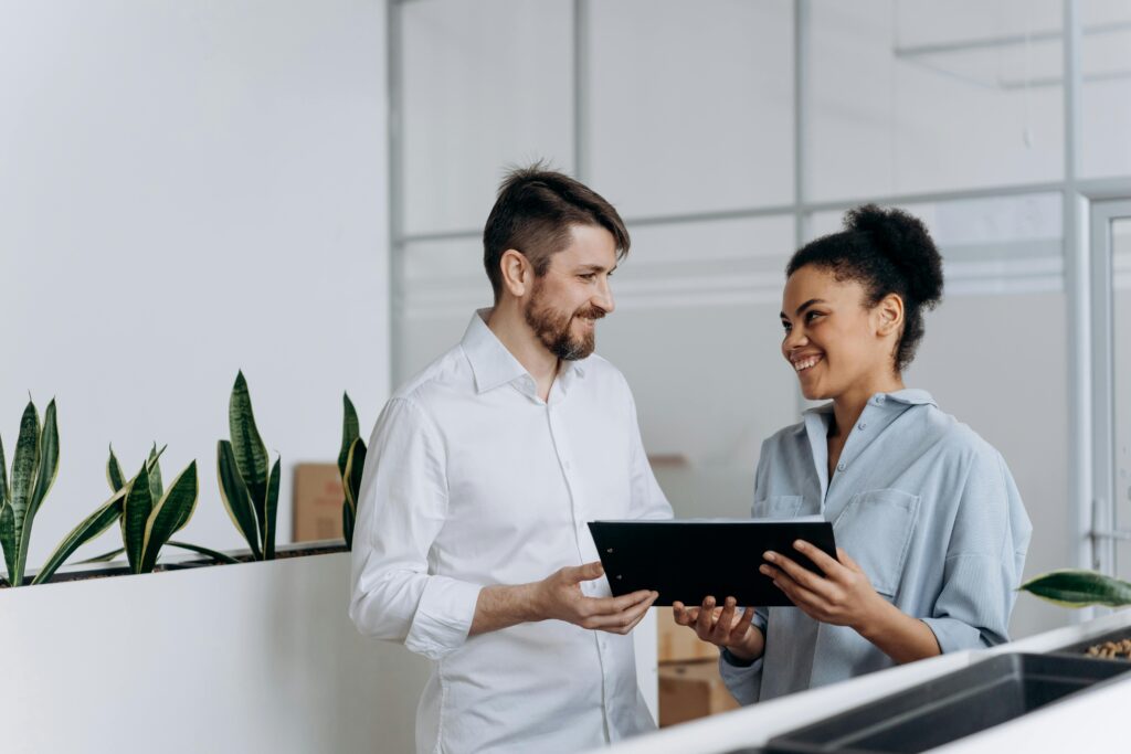 Employees Standing while Looking at Each Other