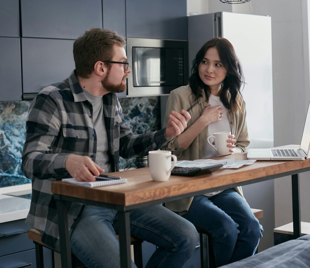 woman and man sitting at desk