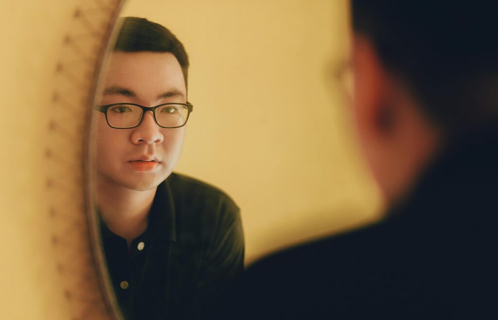 man looking in mirror