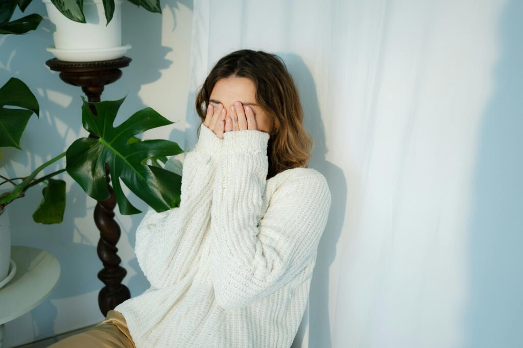 embarrassed woman with white jersey